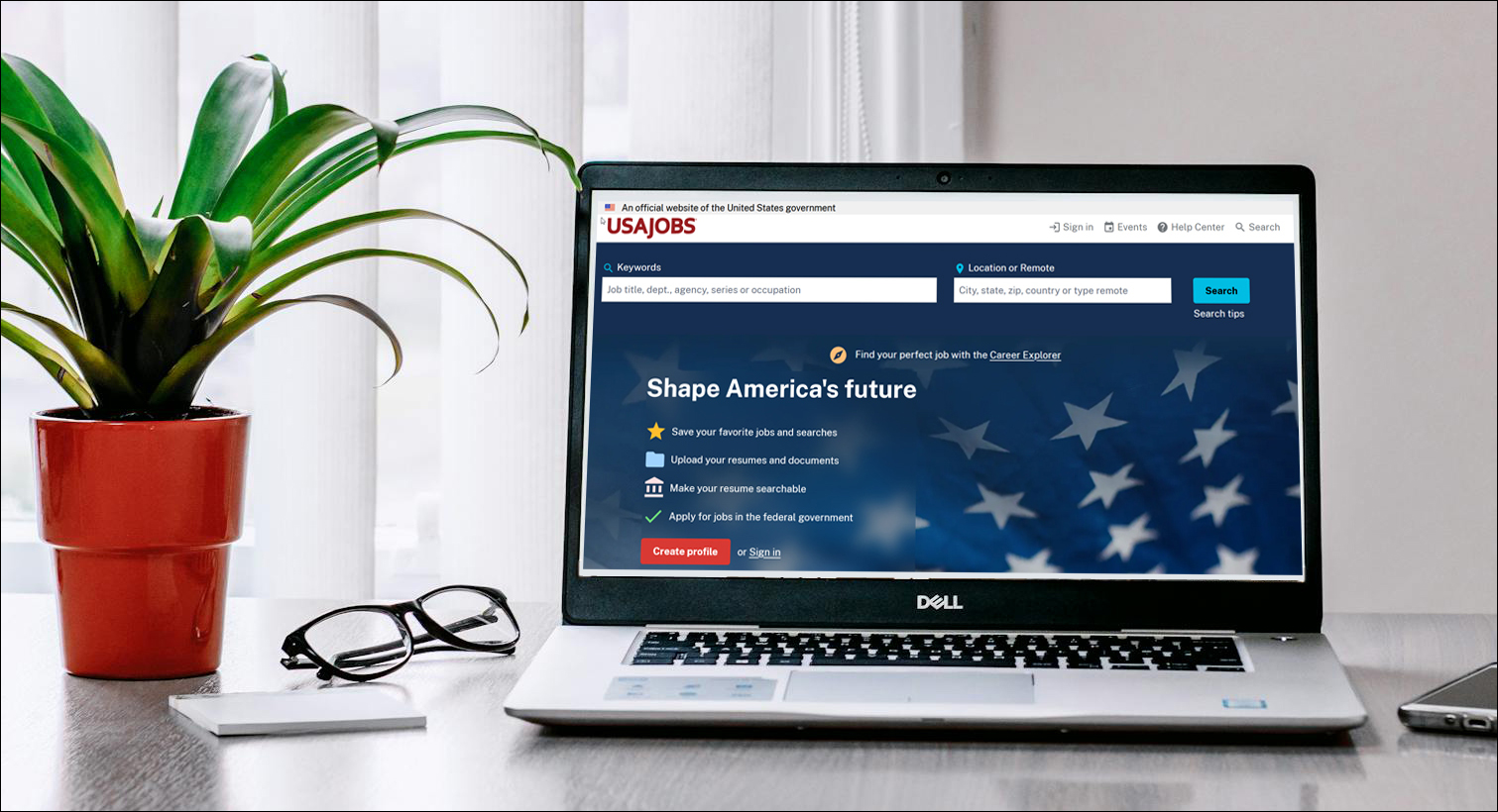 Laptop computer on table with USAJOBS website on screen.